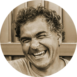 Man with a squinty eyed smile