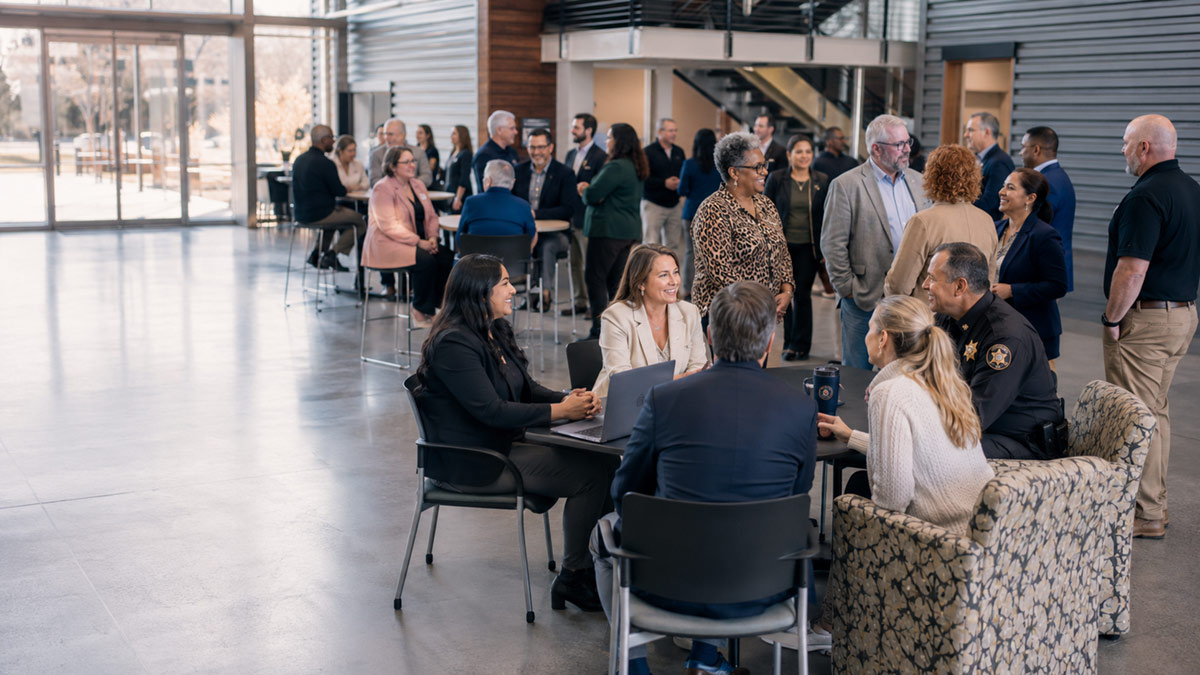 Justice Institute partners, college employees, and public safety professionals gathered in a modern campus setting