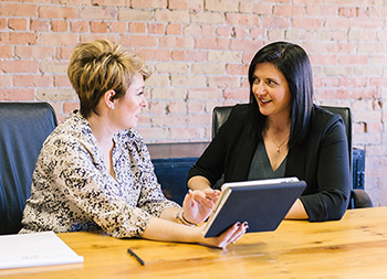 two women in a meeting